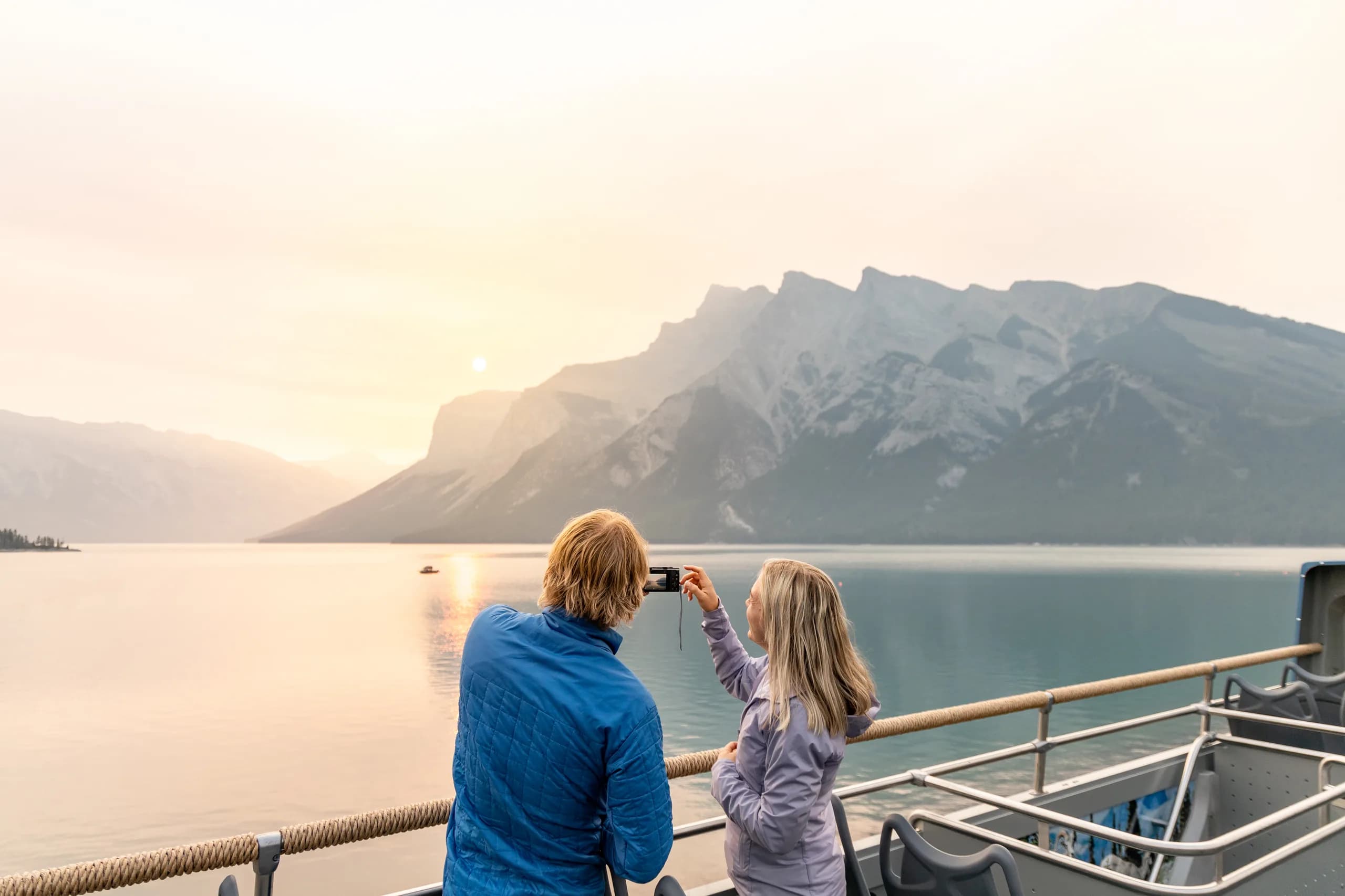 Travellers taking in mountain views during a shuttle journey